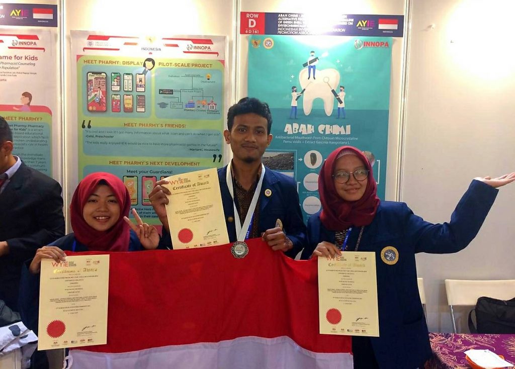 From the left: Revi Istighfarini, Alvin Rubiantoro Priadi, and Nely Sary after winning silver medal at World Young Innovation, Invention and Exhibition (WYIE) in Tertiary Level (Biotechnology and Health) category in Kuala Lumpur, Malaysia.